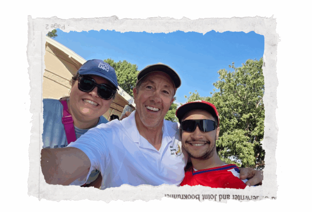 Jim Labenz taking a joyful selfie with two friends while serving with Men Serving God